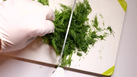 Closeup Man Hands Cutting Green Dill with knife Stock Footage 146668771
