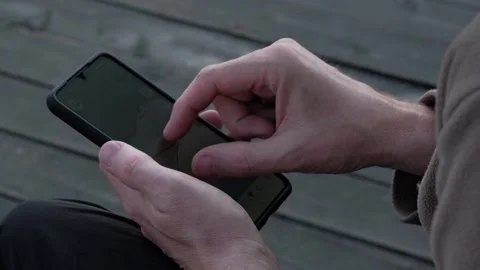 Closeup of man hands looking at map on mobile phone. looks for travel directions Stock Footage 246514604
