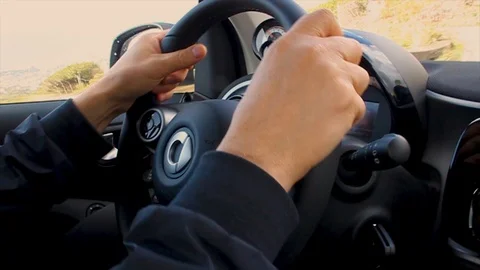 Closeup man hands oncar steering wheel. Male driving vehicle Video stock 120421319