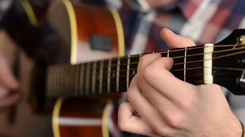 Closeup of man hands playing guitar Stock Footage 69740026