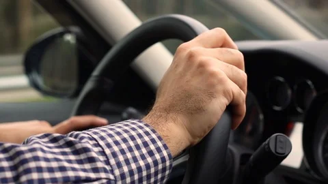 Closeup of man hands on steering wheel driving car. Stock Footage 104192636