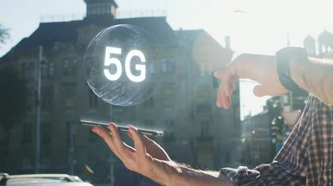 Closeup of man hands tapping 5G internet using tablet outside. Sunny background Stock Photos