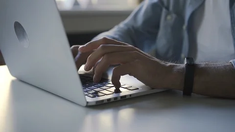 Closeup of man hands typing at laptop in the business workplace office Stock Footage 125801597