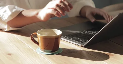 Closeup of man hands using laptop at a cafe Stock Footage 152197300