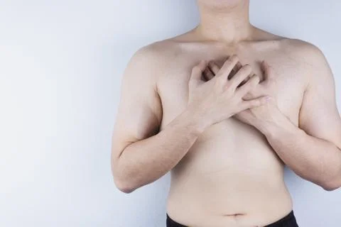 Closeup man having heart attack or chest pain. Health care and medical concep Stock Photos