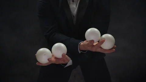 Closeup of man juggling balls. Concept of success, business and managing Stock Footage 127384169