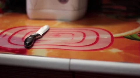 Closeup of a man in the kitchen cut the pork on a cutting Board Stock Footage 71114042
