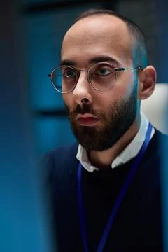 Closeup Man Looking at Screen in Blue Light Stock-Fotos