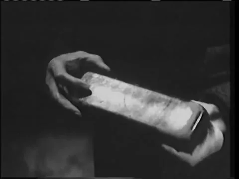 Closeup of man opening small case with surgical instruments inside, 1940s 動画素材 58858831