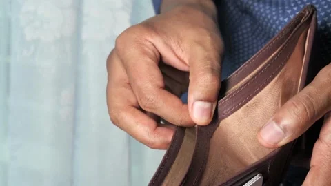 Closeup man opens an empty wallet with no money has nothing to pay. Poverty, Stock-Footage 336450643
