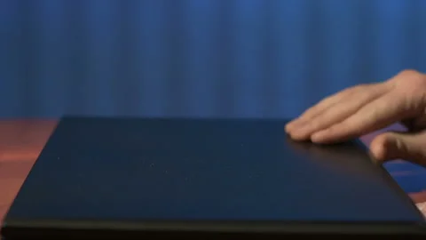 Closeup of man opens lid of laptop and starts typing text Video stock 85601237