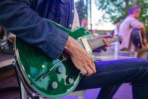 Closeup of man playing guitar Stock Photos