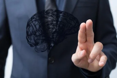 Closeup of a man pointing into 3D rendered human brain anatomical model Foto stock