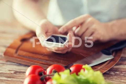 Closeup of man pointing finger to smartphone Stock Photos