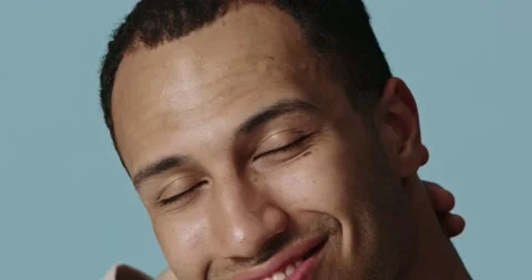 Closeup of man posing touching face after beauty routine. Guy looking camera Stock Footage 221995683