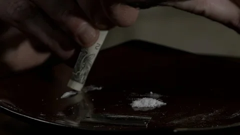 Closeup Man Rolls Up Bill And Snorts Cocaine Stock Footage 100649358