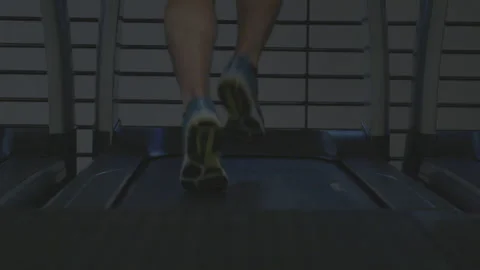 Closeup of a Man Running on a Treadmill Stock Footage 154003599