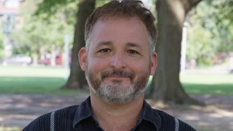 Closeup - A man screams into the camera - shot on RED Stock Footage 124717340