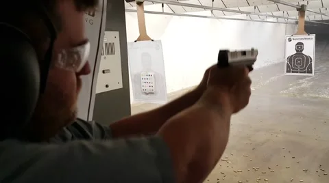 Closeup of man shooting pistol Stock-Footage 61270802
