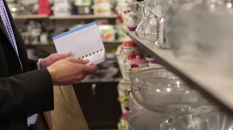 Closeup of a man with a shopping list in a notebook Stock Footage 59319427