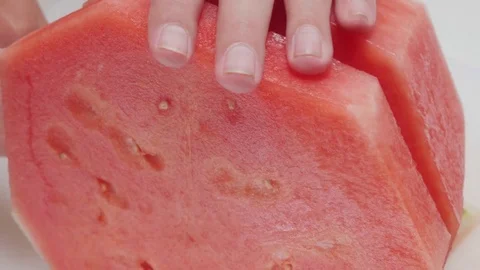 Closeup of a Man Slicing a Watermelon Stock Footage 79041024