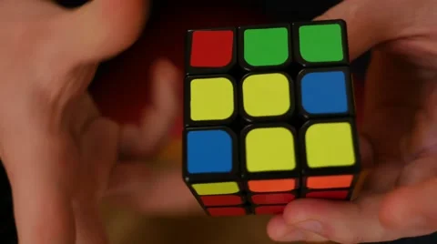 Closeup of man solving rubiks cube Stock Footage 48932131