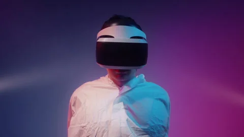 Closeup of A man in a straight jacket using VR technology 스톡 동영상 258541156