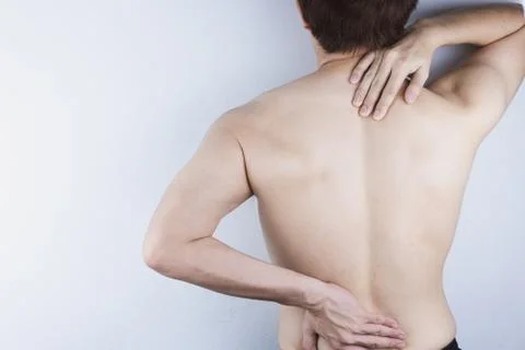 Closeup man suffering from lower back and neck pain. Health care and medical  Stock Photos