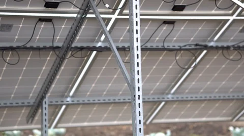 Closeup man with tablet in hand stand beside of solar panels Video stock 126552832