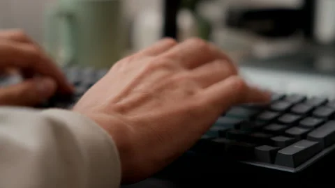 Closeup of Man Typing on Mechanical Keyboard Stock Footage 217957475
