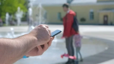 Closeup of man typing text message on smartphone or hands using mobile phone in Stock Footage 258655695