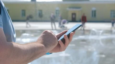 Closeup of man typing text message on smartphone or hands using mobile phone in Stock Footage 267730203