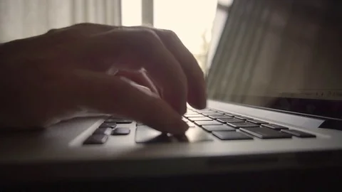 Closeup Man Typing By Window Vídeos de archivo 78184983
