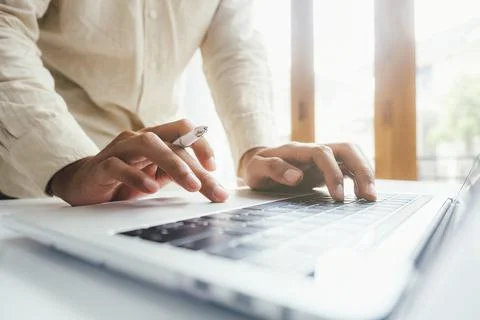 Closeup man using computer online. Stock Photos