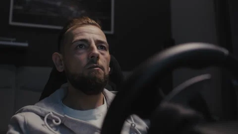 Closeup of A man using a driving simulator Stock-Footage 258389798