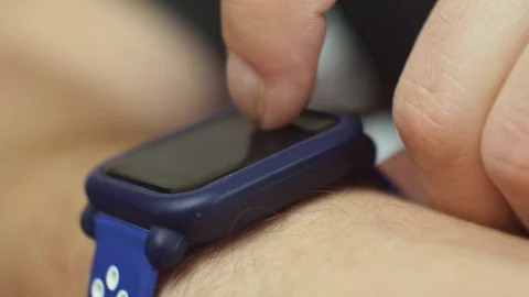 Closeup Of Man using His Smartwatch Stock-Footage 106257107
