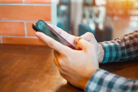 Closeup man using mobile smartphone connect online social Stock Photos