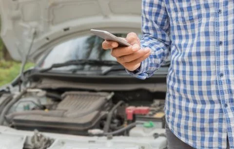 Closeup man using phone call emergency car service Stock Photos
