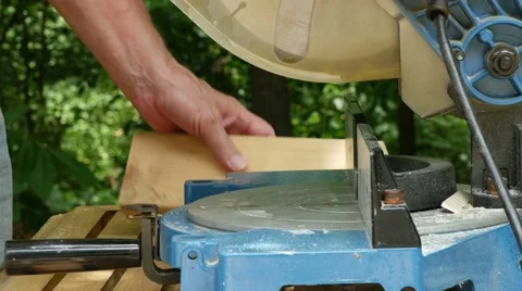 Closeup of Man Using Power Tool Miter Saw 01 HD 4K Video stock 40001922