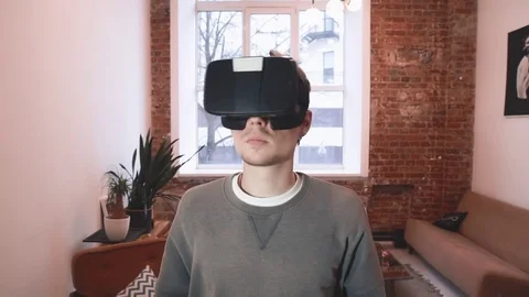 Closeup of man using virtual reality headset, VR mask Stock Footage 73595757