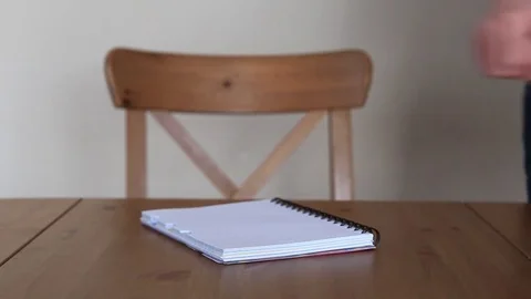 Closeup of man writing on a notepad. Stock Footage 72777486