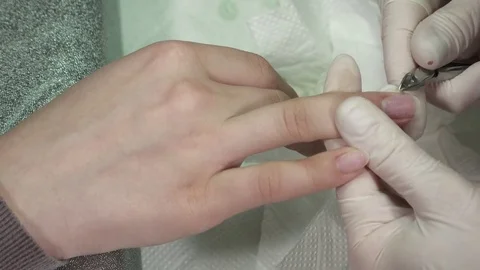 Closeup of manicure master cutting the cuticula on different fingers Stock Footage 73439871