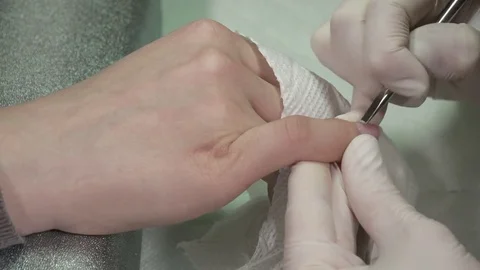 Closeup of manicure master getting rid of the cuticula Stock Footage 73425044