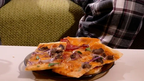 Closeup of man's and woman's hands talking pieces of pizza Stock Footage 71782962
