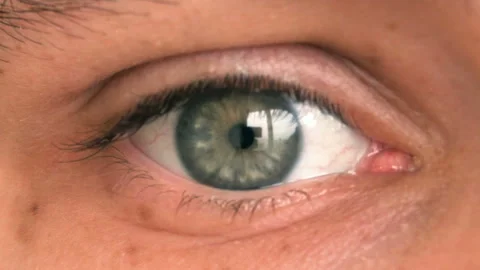 Closeup of man's eye moving looking around Stock Footage 87387426