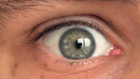 Closeup of man's eye moving looking around Stock Footage 87782871