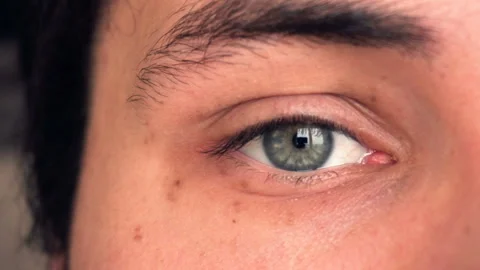 Closeup of man's eye moving looking around Stock Footage 87782973