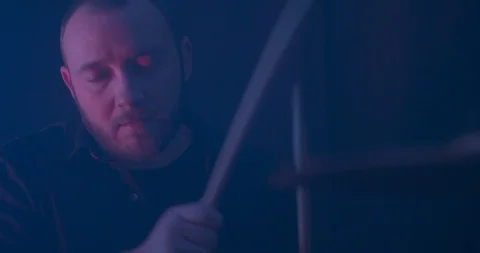 Closeup of a Man's Face as He Plays the Drums Stock Footage 98911357