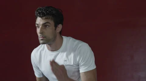 Closeup of a man's face working out, doing side step ladder exercise Stock Footage 63818651