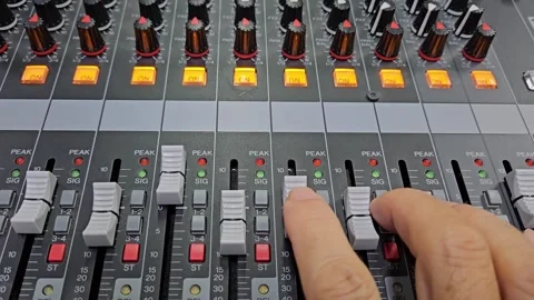 Closeup of man's hand adjusting audio mixer. Recording soundtrack or radio live. Vídeos de archivo 285820655